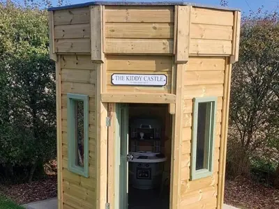 a wooden out house with a sign that reads theory clinic at 9 Bed in Ipswich oc-62352 in Freston