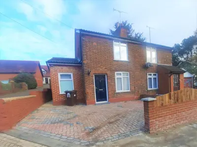 a red brick house with a brick driveway at Colchester 3-Beds Sleeps 5 with Parking & WiFi in Colchester