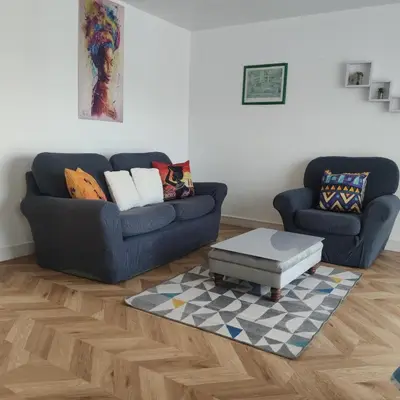 a living room with a couch and a coffee table at Apartment - Sleeps 4 - Parking - WiFi in Colchester