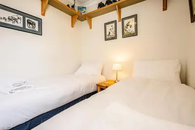 two beds sitting next to each other in a room at 29 Wentworth Road, Aldeburgh in Aldeburgh