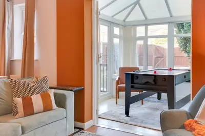 a living room with a ping pong table in a room at Cosy Two bedroom house - Chelmsford - Free Parking and Wifi in Chelmsford