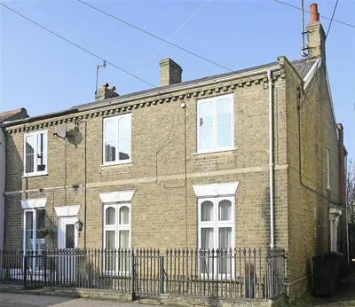 an old brick building with white windows and a fence at 3 Bed in Woodbridge oc-tst in Melton