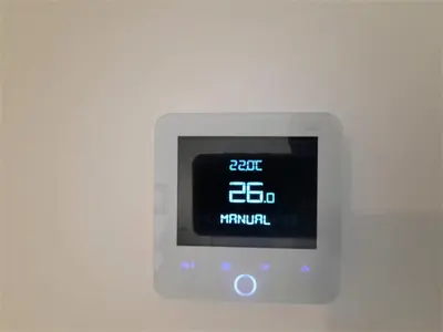an electronic clock on a white wall with the time at Ipswich - 3 Beds - Sleeps 6 - Private Garden in Ipswich
