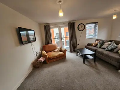 a living room with a couch and a chair at Ipswich - 3 Beds - Sleeps 6 - Private Garden in Ipswich