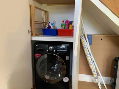 a washer and dryer in a small room at Private 2 Bedroom Apartment at Woodland Retreat in Gamlingay