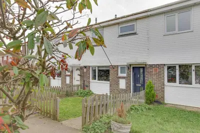 a house with a fence in front of it at Blackwater Terrace Witham in Faulkbourne