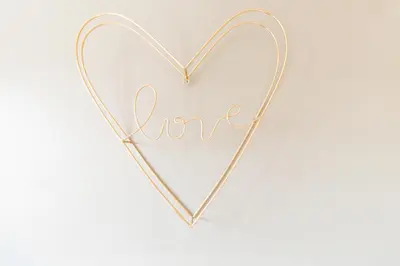 a heart shaped metal sign with the word love at Cambridge 4 Bedroom Sleeps 9 Wi-Fi Garden, LONG STAYS ACCEPTED- Orchid House in Cambridge