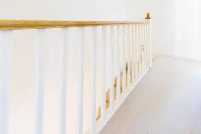 a hallway with white walls and a stair railing at Cambridge 4 Bedroom Sleeps 9 Wi-Fi Garden, LONG STAYS ACCEPTED- Orchid House in Cambridge