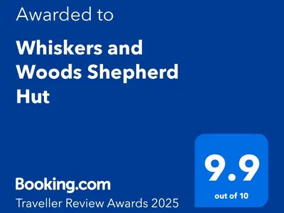 a blue text box with the wordsbreakers and woods shepherdhoff at Whiskers and Woods Shepherd Hut in Denham