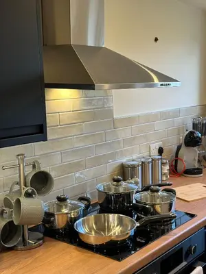 a kitchen with pots and pans on a stove at Central Cambridge Apartments by Tas in Cambridge