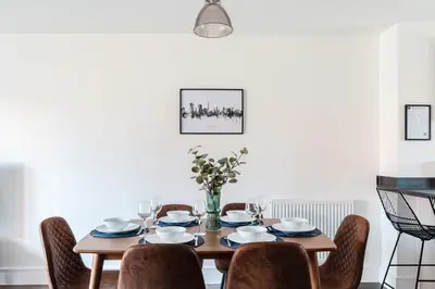 a dining room with a table and chairs at 4 Bed, 3 Bath in Colchester - Business, Contractor and Leisure - Singles or Superkings - Disc0unts in Colchester