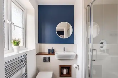 a bathroom with a sink and a mirror at 4 Bed, 3 Bath in Colchester - Business, Contractor and Leisure - Singles or Superkings - Disc0unts in Colchester