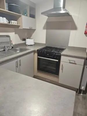 a kitchen with a stove and a sink at Jenny,s place in Saint Osyth