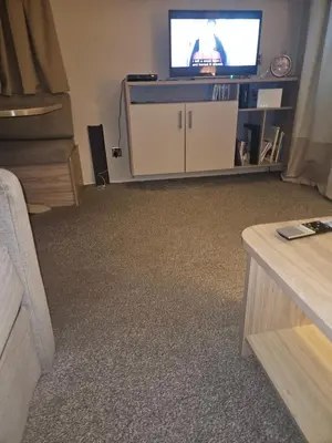 a living room with a tv and a couch at Jenny,s place in Saint Osyth
