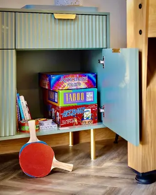 a room with a shelf with food and a red chair at Luxury Stay, City Walk, Pool Table & Air Hockey, Garden, Parking, Business & Families - Oakview in Colchester