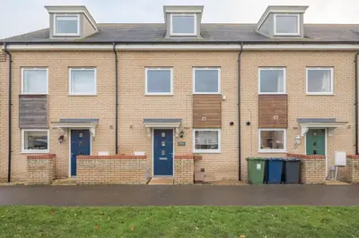 a brick house with blue doors and windows at Modern and Comfy 3 bed Cambridge House in Cambridge