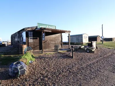 a small shack with a turtle on a gravel road at 11a Market Cross Place in Aldeburgh