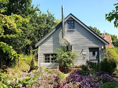 a small house with flowers in front of it at Twosome in Halesworth