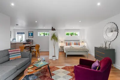 a living room with a couch and a table at Barn studio in Long Melford in Long Melford
