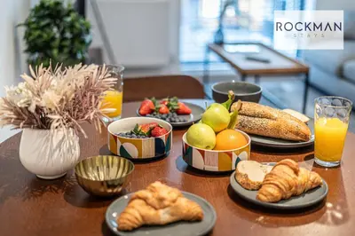a table topped with plates of food and fruit at Royal Oak Apartments 3 - Secure Parking - Perfect for Contractors - 2 Bedroom - 2 Bathroom - Fast Wi-fi - Long Term Stays - in Brentwood