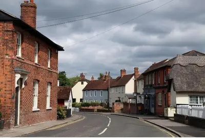 an empty street in a town with brick houses at Chelmsford Cottage Free Parking Fab Garden in Great Waltham