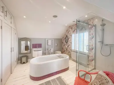 a large bathroom with a tub and a shower at Spinneys Beachfront home, Indoor Pool UK-Vacations in Thorpeness