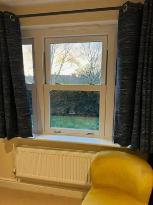 a yellow chair sitting in front of a window at Riverview Colchester in Colchester