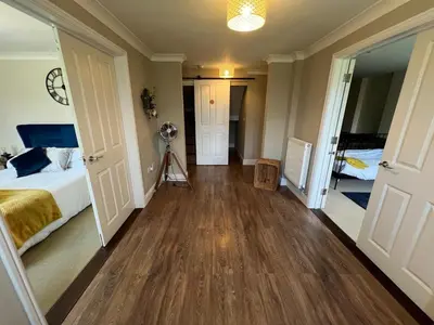a bedroom with a bed and a hard wood floor at Riverview Colchester in Colchester