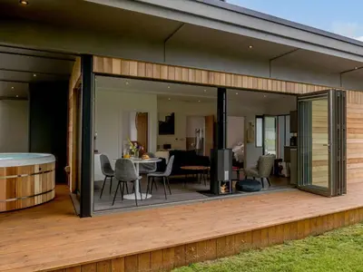 an extension of a house with glass doors and a deck at 2 Bed in Colchester oc-82398 in East Bergholt
