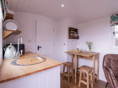 a kitchen with a sink and a counter top at Bumble's Retreat in Whepstead