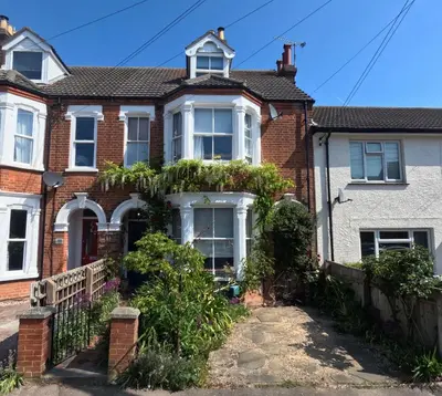 an old brick house with plants on the facade at St Elmo Felixstowe in Felixstowe