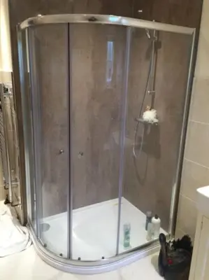 a shower with a glass door in a bathroom at Relaxing country cottage bungalow in Yaxley