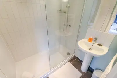 a bathroom with a shower and a sink at Tiger House Stevenage 5 Bed 4 Bath Group Bookings in Stevenage
