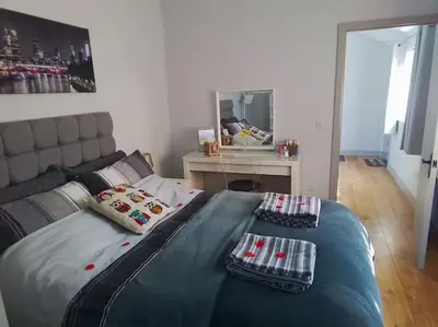 a bed with two pillows on it in a bedroom at Owlhoot Annexe in Sudbury