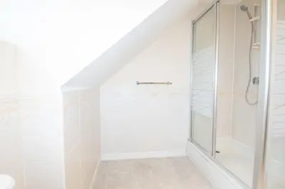 a bathroom with a shower and a toilet at Group Retreat Perfect Home with FREE Parking in Freston