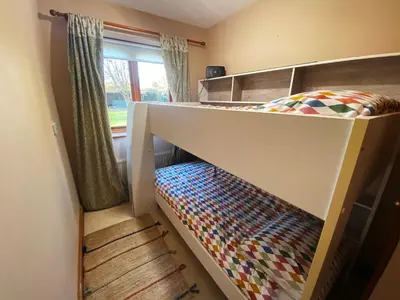 a bunk bed in a room with a bunk bed at Rivendell in Diss