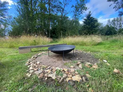 a black table sitting in the middle of a field at Rivendell in Diss