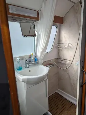 a bathroom with a sink and a shower at New Horizon - A beautiful boat very conveniently located in Chelmsford City in Chelmsford