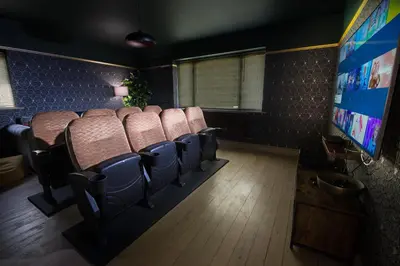 a waiting room with chairs and a flat screen tv at Deluxe 2 3 Bed HotTub SkyTV in Saffron Walden