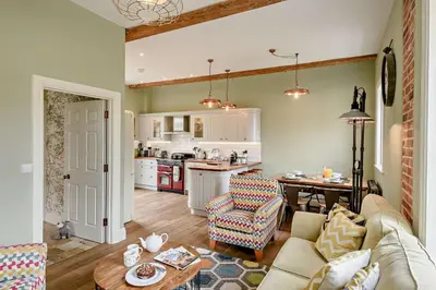 a kitchen and living room with a couch and a table at 2 Bed in Blythburgh oc-t27735 in Blyford