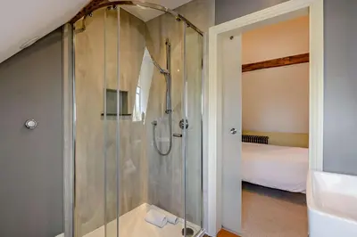 a shower with a glass door in a bathroom at 2 Bed in Blythburgh oc-t27735 in Blyford