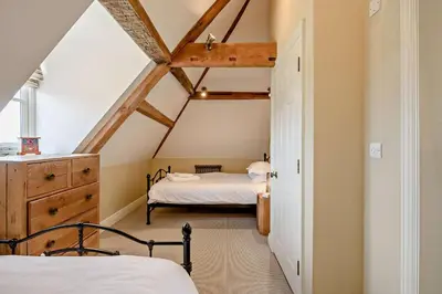 a bedroom with two beds in a attic at 2 Bed in Blythburgh oc-t27735 in Blyford