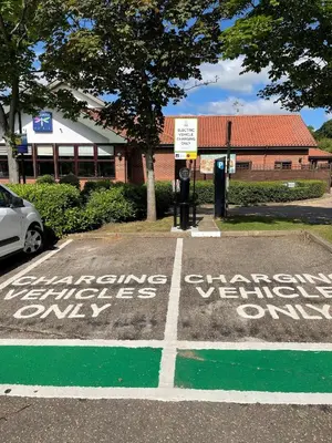 a parking lot with writing on the ground at Dragonfly Hotel Colchester in Colchester