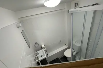 a bathroom with a toilet and a glass shower at Apartment - Sleeps 2 - Parking - WiFi in Colchester