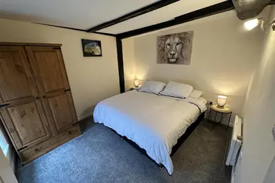 a bedroom with a large bed with two white pillows at Apartment - Sleeps 2 - Parking - WiFi in Colchester
