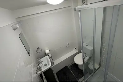 a bathroom with a toilet and a glass shower at Apartment - Sleeps 2 - Parking - WiFi in Colchester