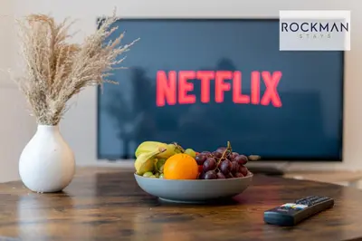a bowl of fruit on a table in front of a tv at Royal Oak Apartments 1 - Free Van Parking - 2 Bedroom Apartment - 2 bathrooms - Sleeps 6 - Perfect for Contractors - Fast Wi-fi in Brentwood