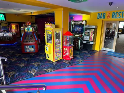 a arcade with two arcade machines and a game at D34 Steeple Bay Caravan Site in Chelmsford