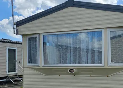 a large window on the side of a house at J.R. Holiday Homes in Clacton-on-Sea