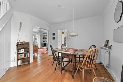 a kitchen and dining room with a table and chairs at St John's Corner Cottage, Bury St. Edmunds in Bury Saint Edmunds